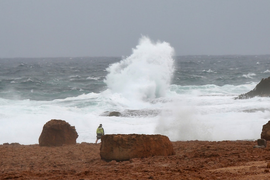 A big swell and waves crash into rocks at the Blowholes near Carnarvon.