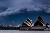 A shelf cloud rolls over Sydney, with the Sydney Opera House prominent in the foreground.