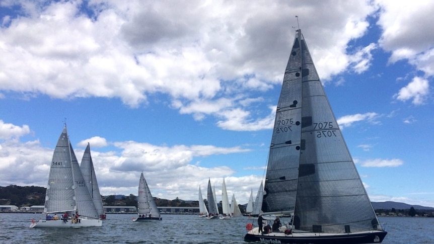 Yachts line up for the start