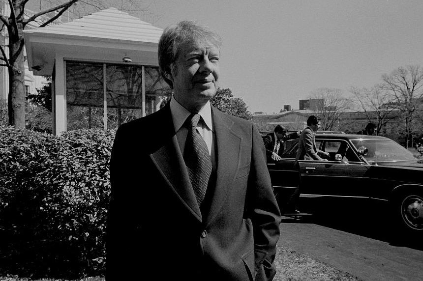 Jimmy Carter in a suit outside the White House
