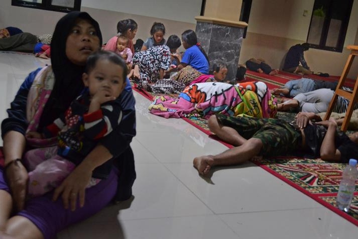 Evacuated residents shelter inside a mosque in Pandeglang regency.