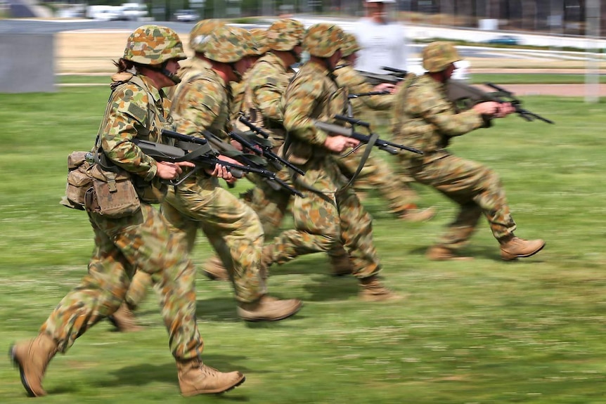 Australian Army soldiers run