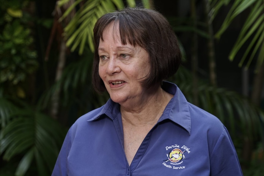 Danila Dilba chief executive Olga Havnen wears a blue uniform shirt at a COVID-19 vaccination press conference in Darwin. 