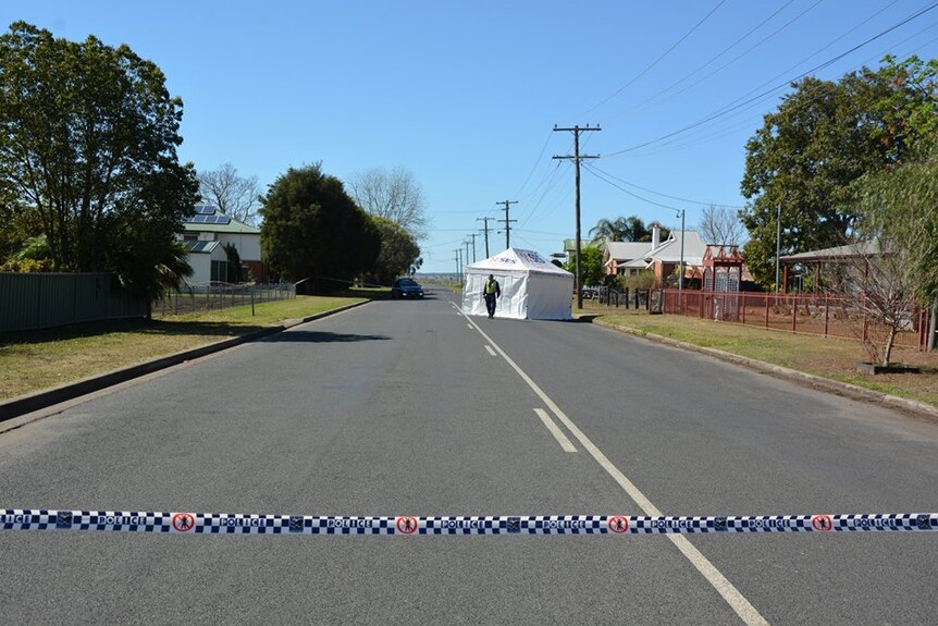 Street with white SES tent on a road in suburbia.