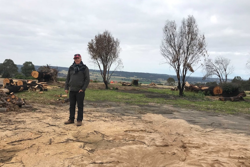 Man standing on burnt out property at Sarsfield.