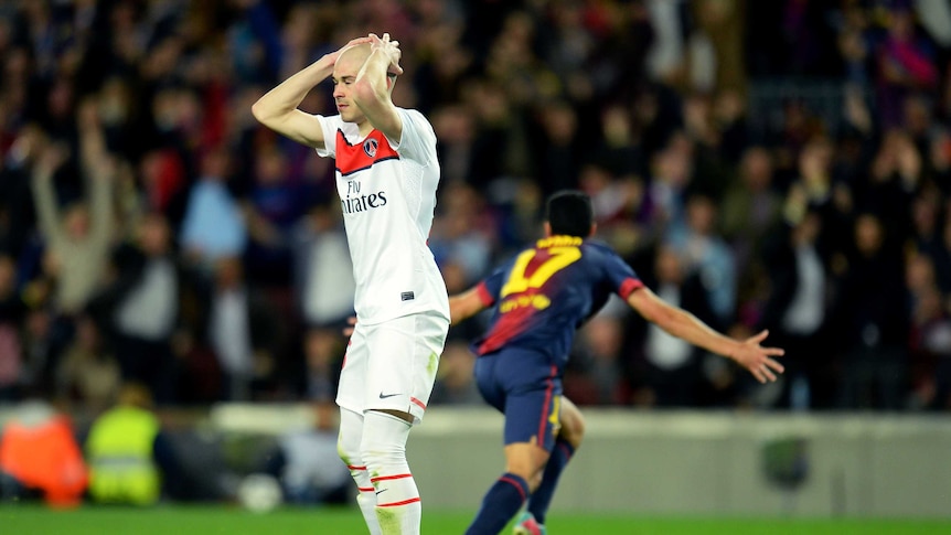 Moment of despair ... PSG's Christophe Jallet shows his dejection as Pedro turns to celebrate his goal