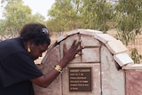 Eddie Mabo's daughter Celuia at grave of land rights pioneer Vincent Lingiari.