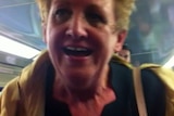 A woman used the word "bogan" during a racist rant on a train.