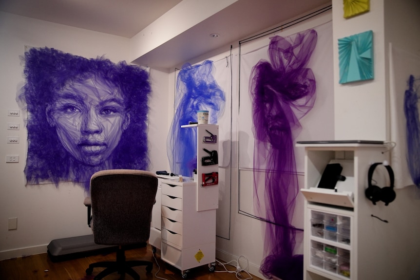 Portraits of faces created from purple tulle.