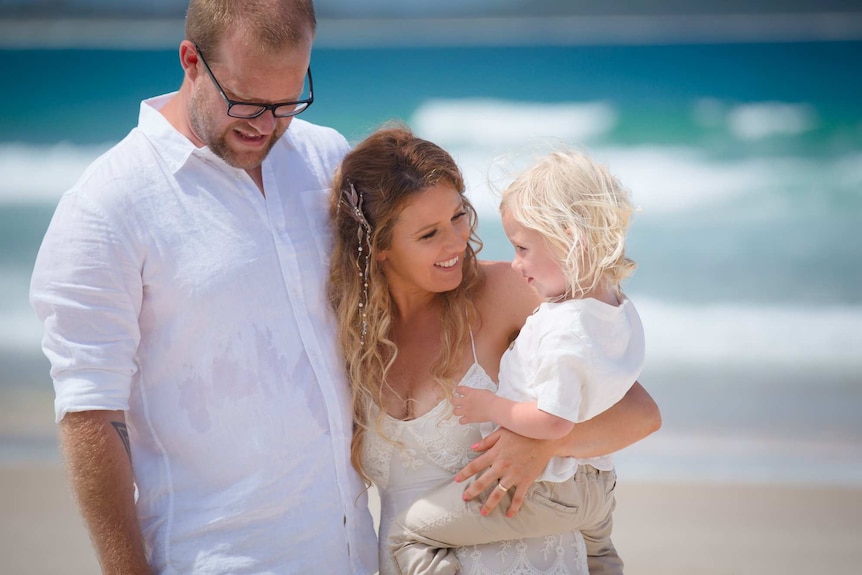 a young family on the beach