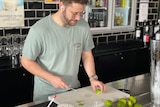 A man slicing limes.