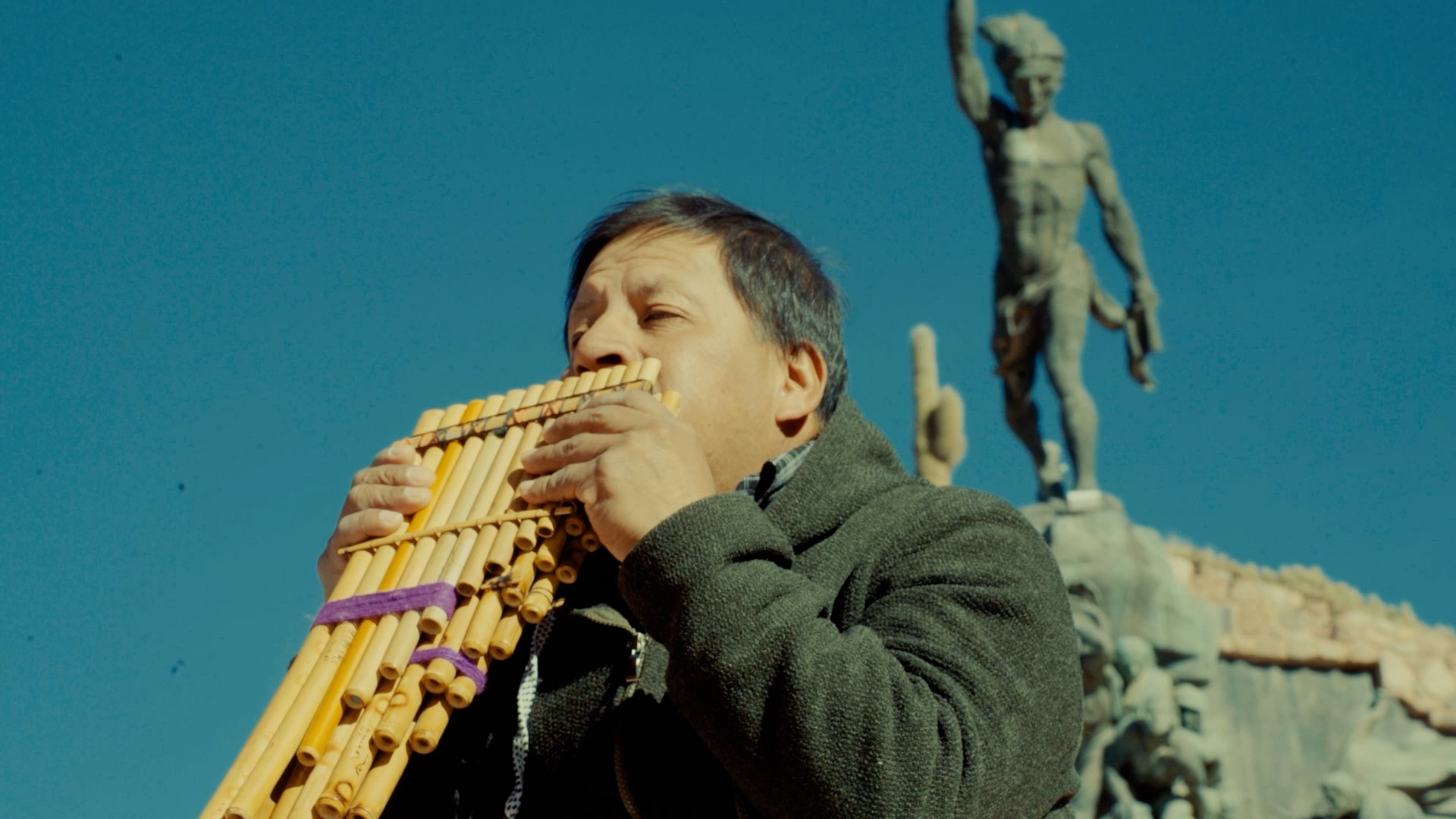 A man plays a pan flute.
