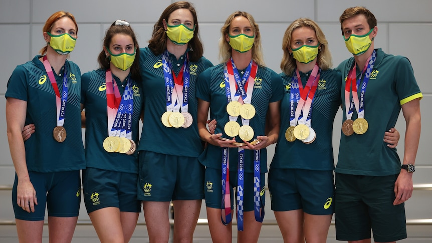Australian swim team with their Olympic medals