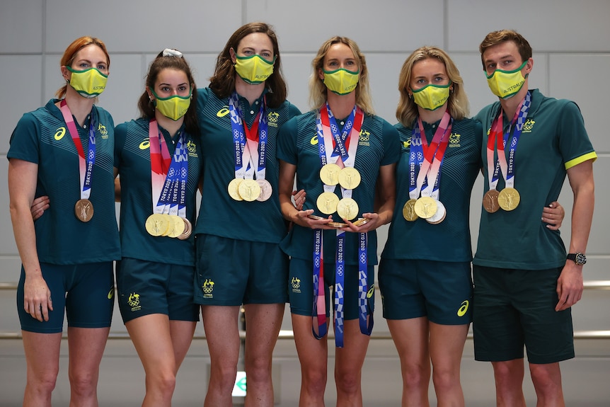 Australian swim team with their Olympic medals