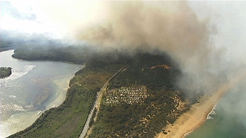 On the south coast, firefighters are trying to put in containment lines around fires at Burrill Lake