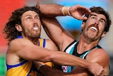 A West Coast AFL player pushes against a Port Adelaide opponent as they look up at the ball in a contest.