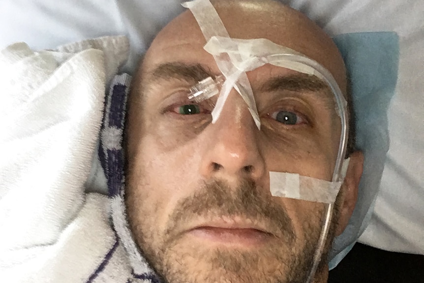 FOGGEL victim and triathlete Darren Lydeamore in hospital with eye damage.