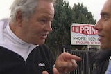 The owner of a Victorian printing business raises his finger as he threatens an ABC crew in Melbourne's north.
