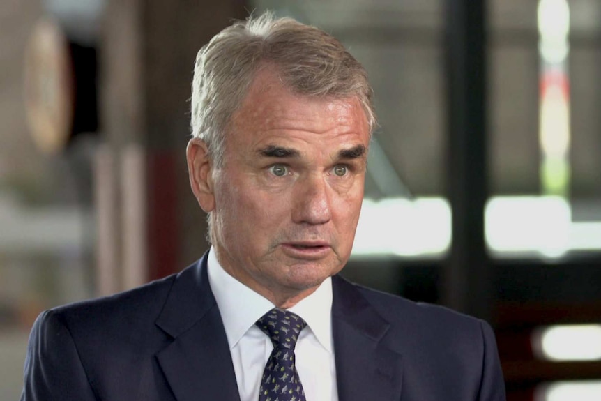 MCU of Snowy Hydro CEO Paul Broad sitting in an office with blurred background