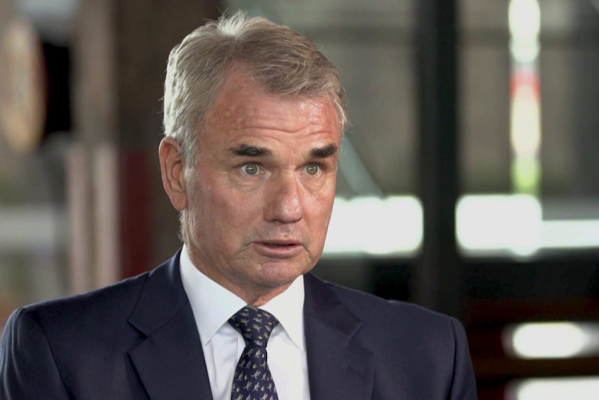 MCU of Snowy Hydro CEO Paul Broad sitting in an office with blurred background