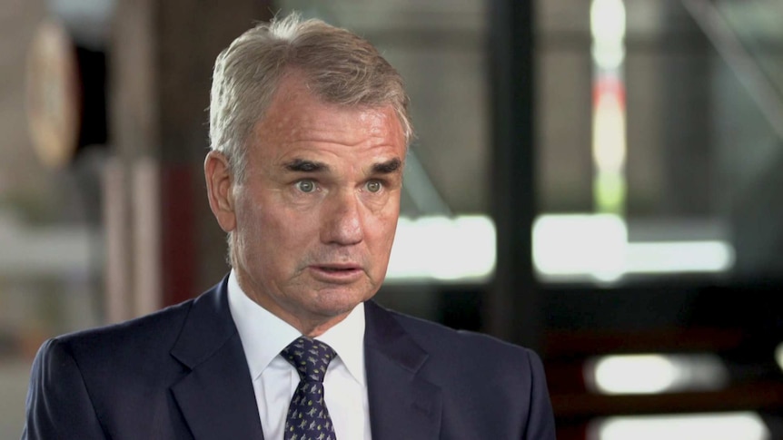 MCU of Snowy Hydro CEO Paul Broad sitting in an office with blurred background