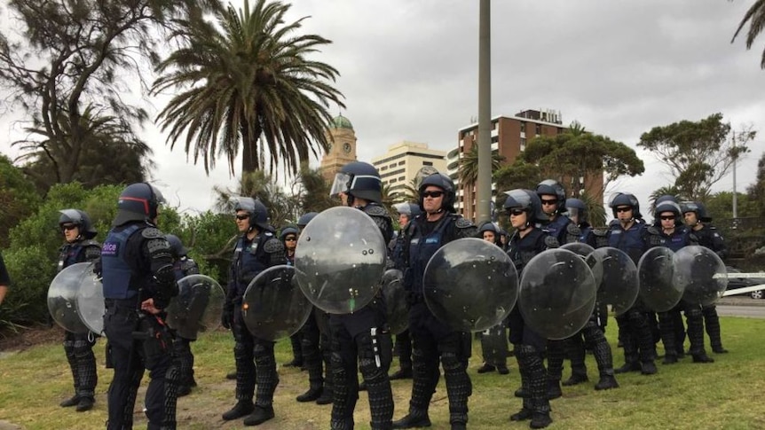 Hundreds of police descend on St Kilda Beach ahead of far-right rally.