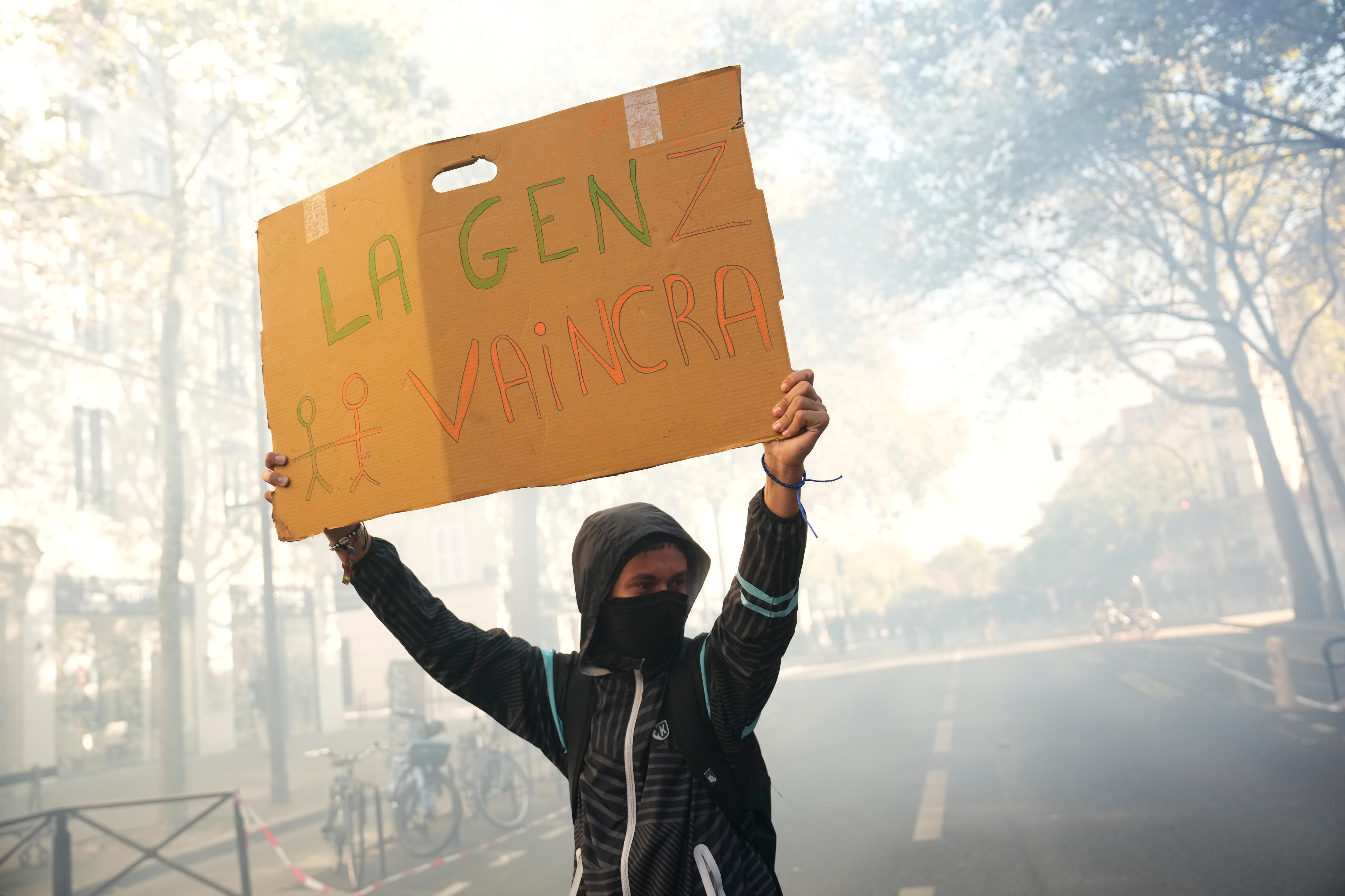 France suspends stun grenade use at student protests