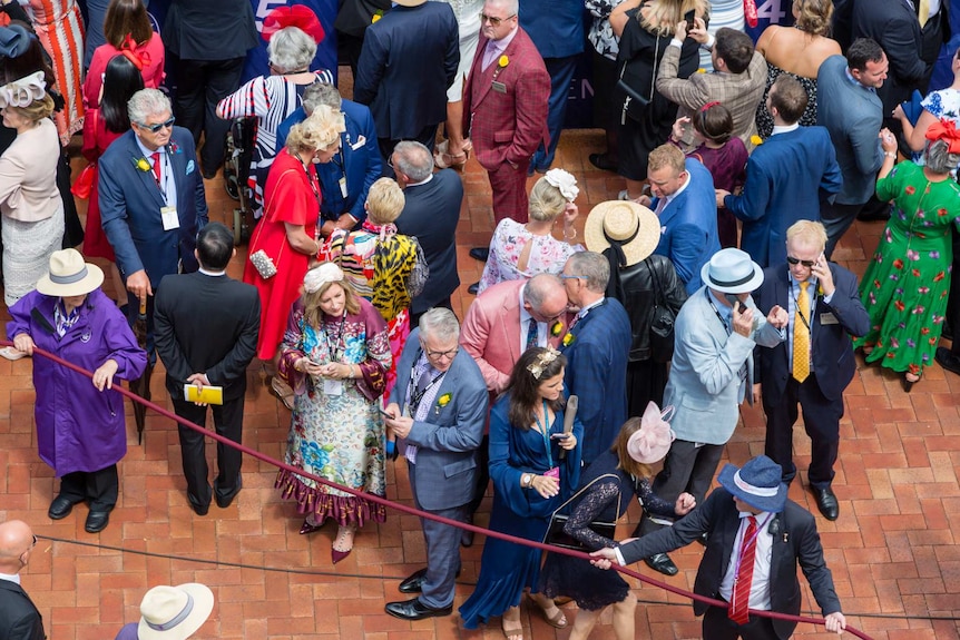 A view of racegoers taken from above.