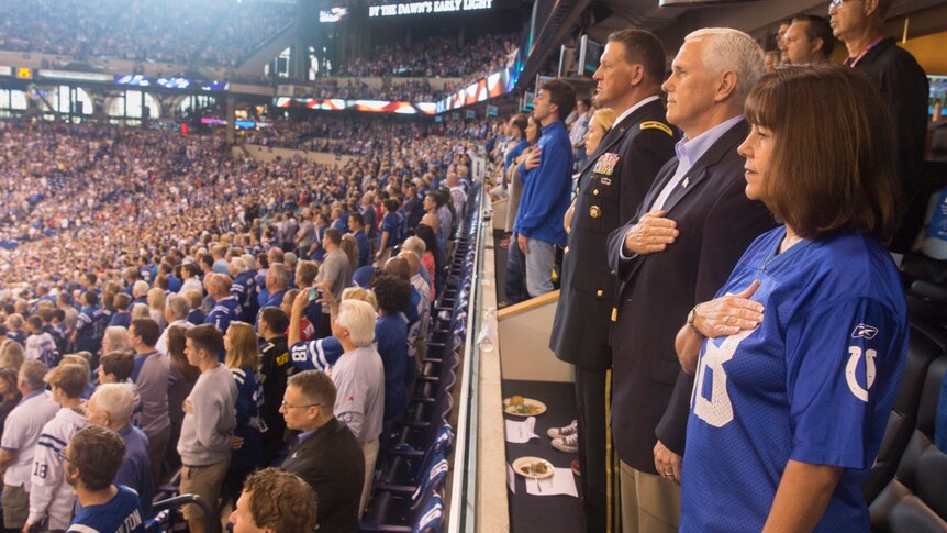 Vice President Mike Pence stands during the anthem