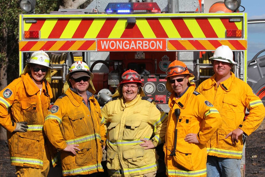 Carole shares a laugh with her fire-fighting brigade