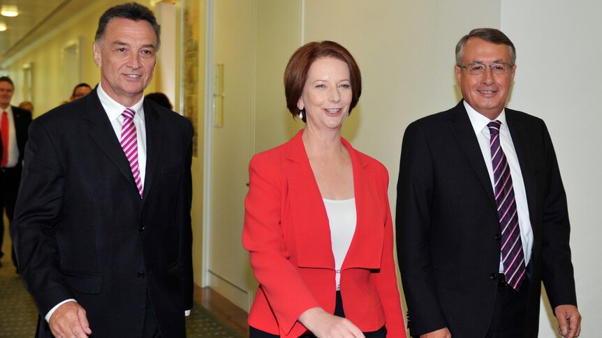 Julia Gillard leaves with Wayne Swan and Craig Emerson after the leadership vote.