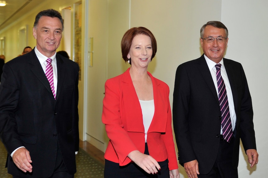 Julia Gillard leaves with Wayne Swan and Craig Emerson after the leadership vote.