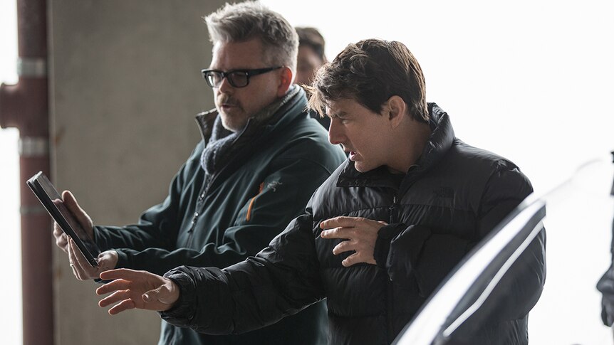 Colour photo director Christopher McQuarrie and Tom Cruise on the set of 2018 film Mission Impossible: Fallout.
