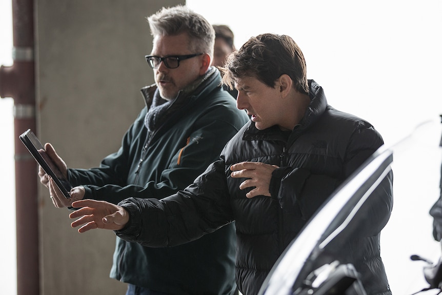 Colour photo director Christopher McQuarrie and Tom Cruise on the set of 2018 film Mission Impossible: Fallout.