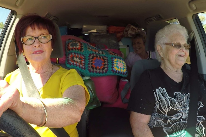 Two hairdressers in the front seat and Back Roads presenter Heather Ewart in the backseat to Normanton