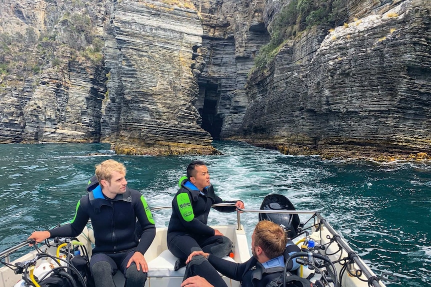 Divers on a boat.