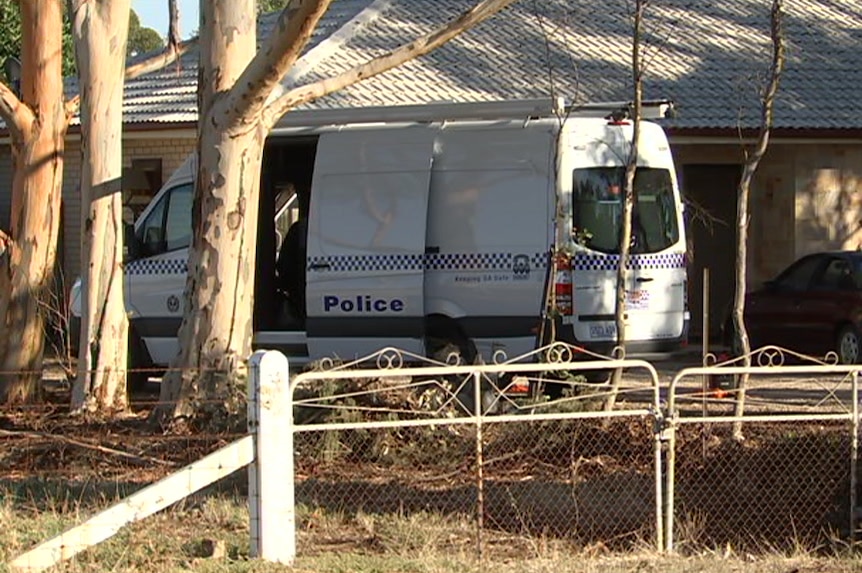 A police van outside a home.