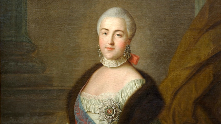 Coloured painted portrait of Catherine the Great standing touching paper scroll, smiling slightly, wearing a dress and shawl.