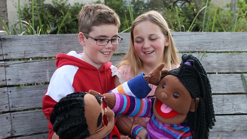 Jacob Scully and Gabriella Phillips with puppets