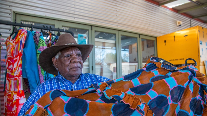 Fitzroy Crossing artist Tommy May painted waterholes from his country used in the Gorman Mangkaja collection.