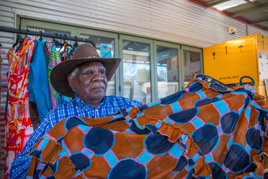 Fitzroy Crossing artist Tommy May painted waterholes from his country used in the Gorman Mangkaja collection.