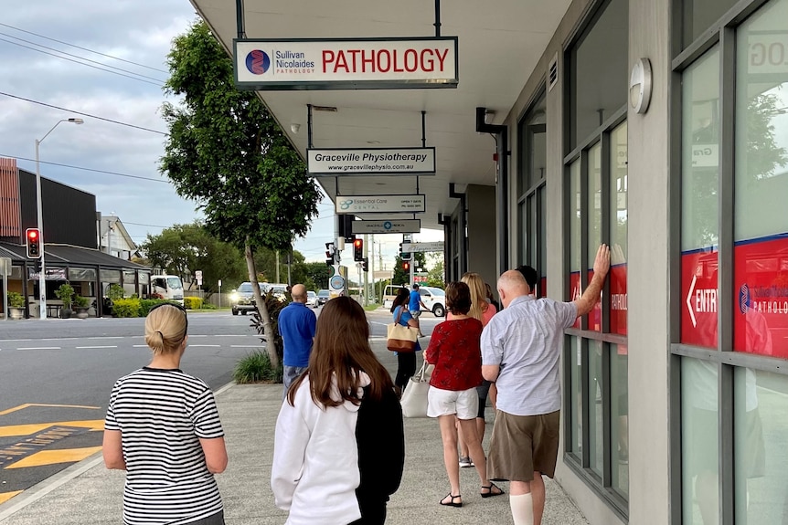 About 10 people were lined up for COVID-19 tests at Graceville, in Brisbane, early on Thursday morning.