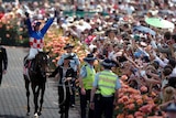 Jockey Glen Boss atop Makybe Diva celebrates a win in the 2005 Melbourne Cup at Flemington.