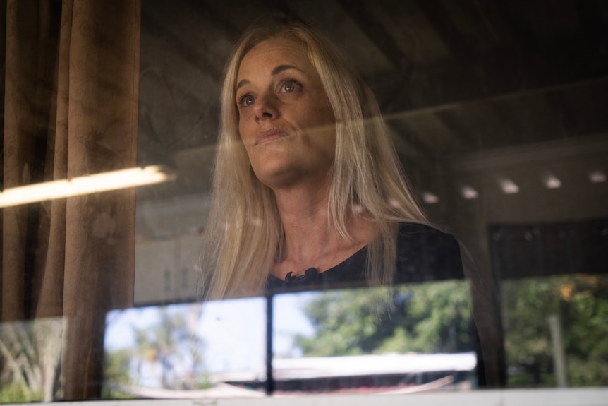 woman looking out window