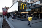 People walk past a McDonald's restaurant in the main street in Moscow, Russia.