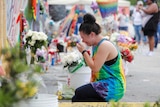 Chelsea Nylen reacts while visiting the memorial outside the Pulse Nightclub