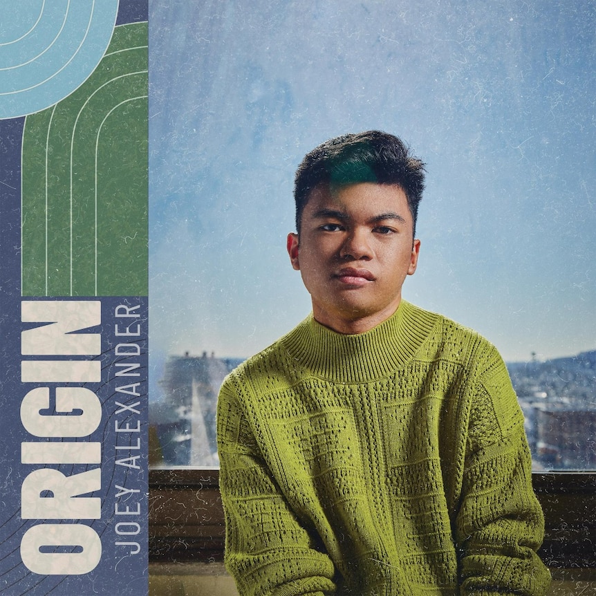 Joey Alexander pictured wearing a green sweater