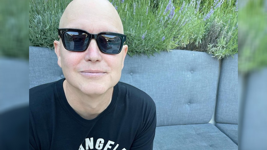 A photo of lMark Hoppus of Blink-182, bald as he undergoes chemotherapy