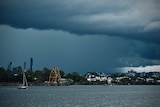 Dark storm clouds over Brisbane river.