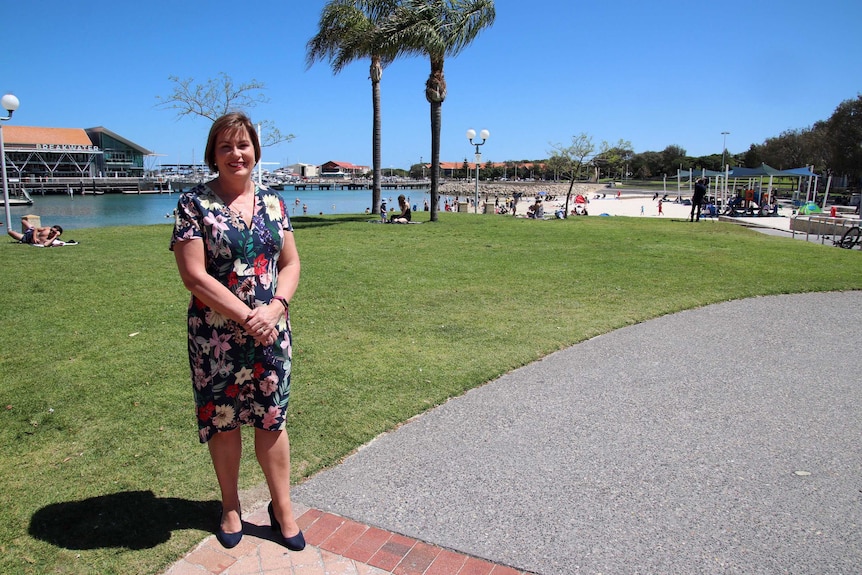 Full-length shot of Marion Fulker in bright sunshine with Hillarys boat harbour in the background.